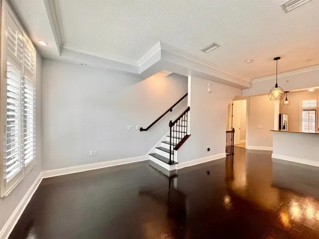 a view of a room with lots of wooden floor