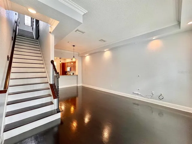a view of a hallway with stairs