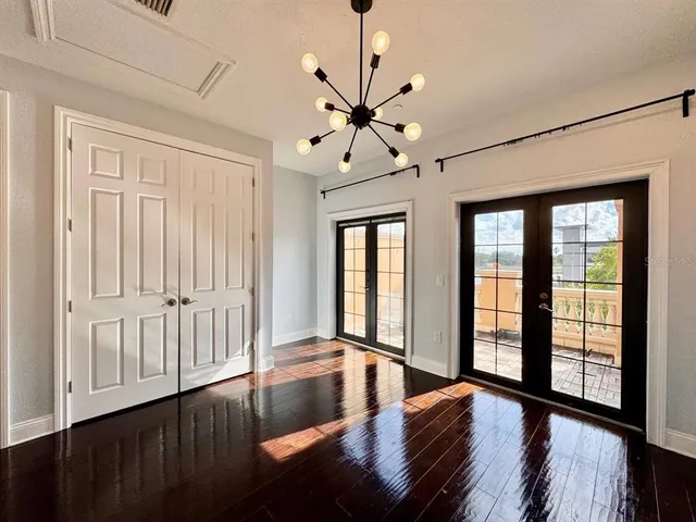 a view of an entryway with wooden floor