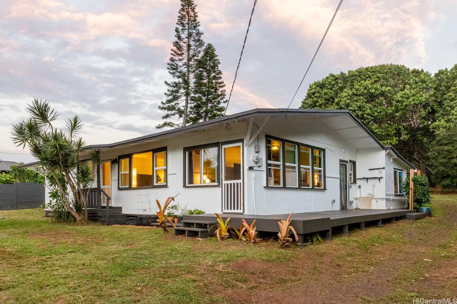 59-450 Alapio Road, Unit B1 Haleiwa, HI 96712 - Photo 1 of 1 a front view of a house with garden