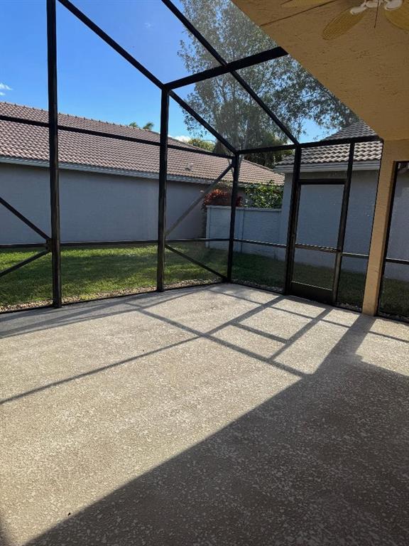 12082 Roma Road Boynton Beach, FL 33437 - Photo 13 of 14 a backyard of a house with wooden fence