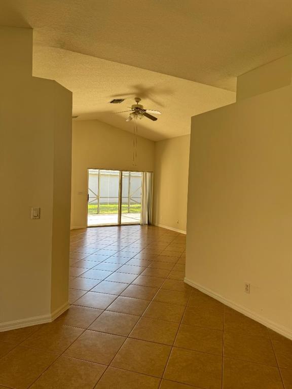 12082 Roma Road Boynton Beach, FL 33437 - Photo 3 of 14 a view of a room with a window and wooden floor