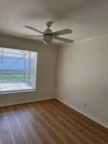 a utility room with cabinets washer and dryer