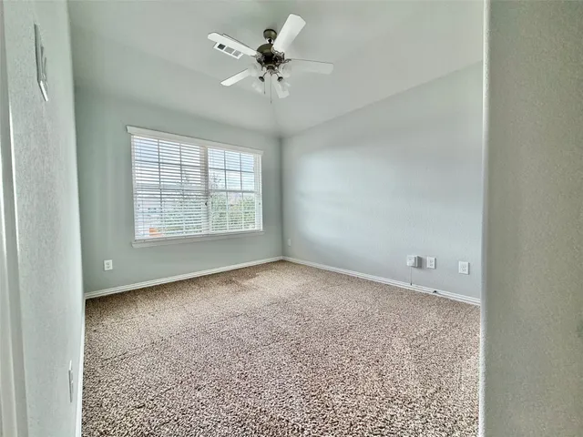 an empty room with a empty space and a window