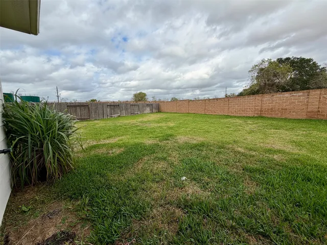 a view of a yard with an trees