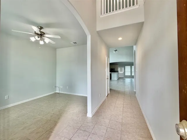 a view of a hallway with a chandelier