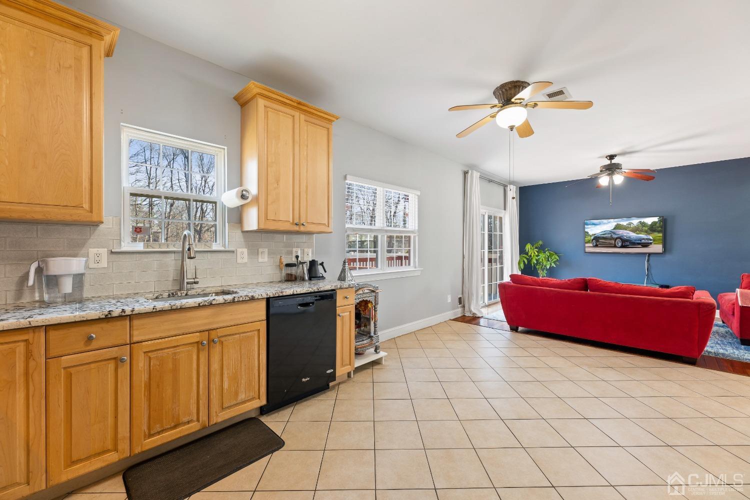 747 Magnolia Road North Brunswick, NJ 08902 - Photo 12 of 36 a kitchen with a sink cabinets and window