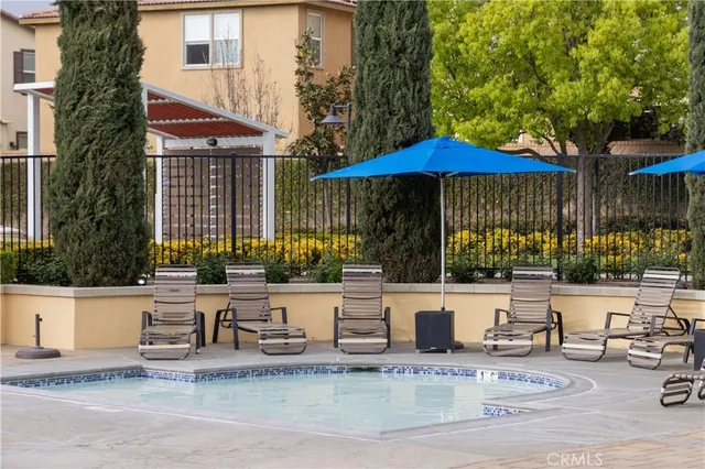 a view of a swimming pool with a lounge chairs