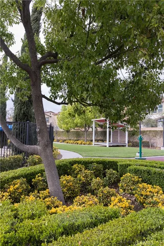 an outdoor space with furniture and umbrella