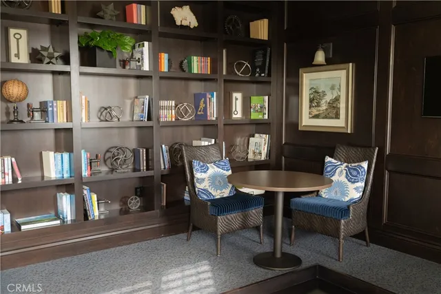 a living room with furniture and a projector