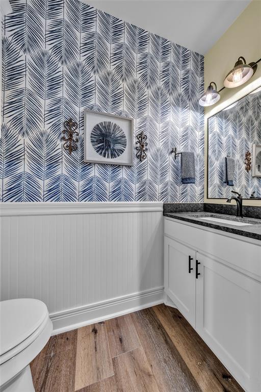 6628 Buffalo Ridge Circle Godley, TX 76044 - Photo 25 of 39 a bathroom with a granite countertop sink and a toilet