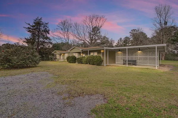 a house with trees in the background