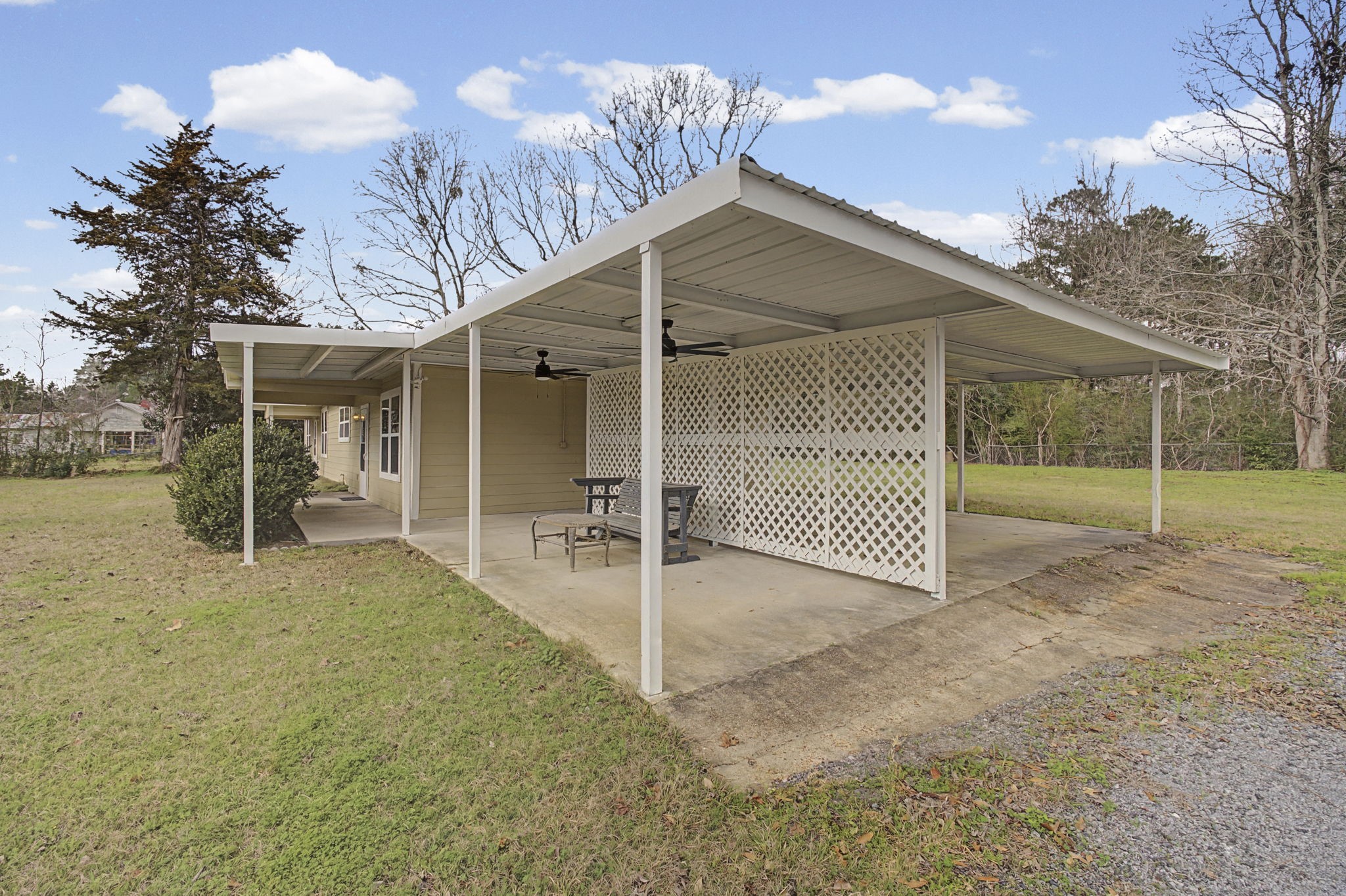 9216 Highway 69 Warren, TX 77664 - Photo 24 of 32 a view of a house with a backyard and porch