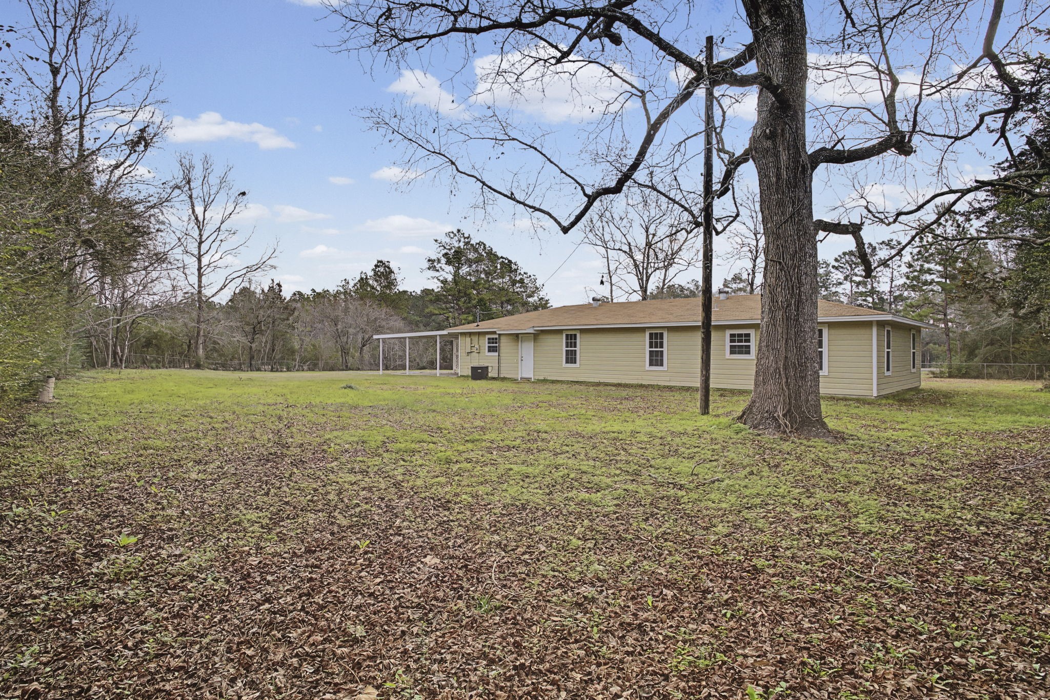 9216 Highway 69 Warren, TX 77664 - Photo 26 of 32 a front view of a house with garden