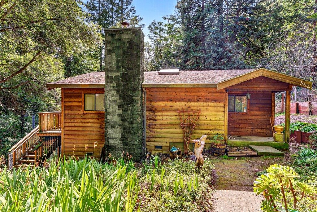 13033 Lompico Road Felton, CA 95018 - Photo 1 of 32 a front view of a house with a yard