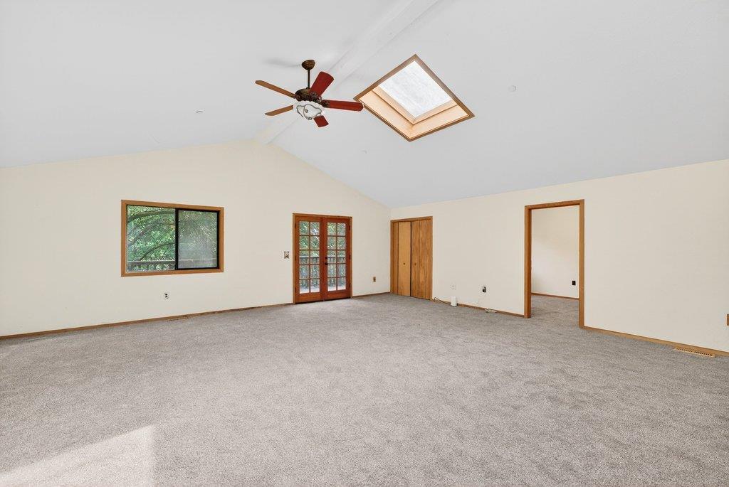 13033 Lompico Road Felton, CA 95018 - Photo 14 of 32 an empty room with windows and fan