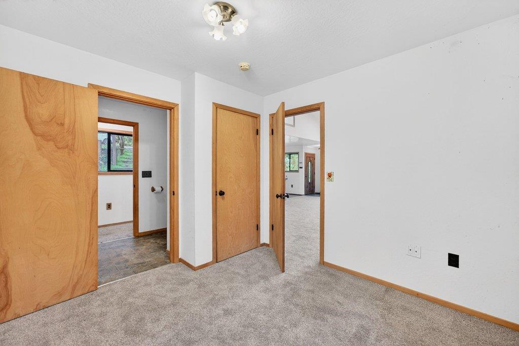 13033 Lompico Road Felton, CA 95018 - Photo 16 of 32 an empty room with closet and a bathroom