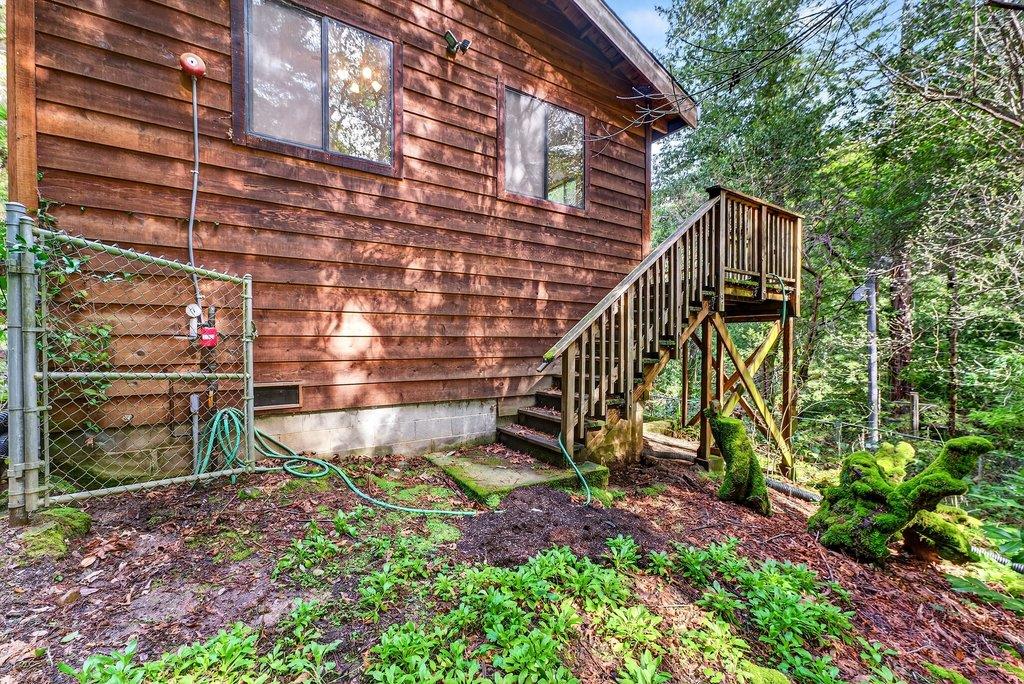 13033 Lompico Road Felton, CA 95018 - Photo 26 of 32 a view of a house with a yard