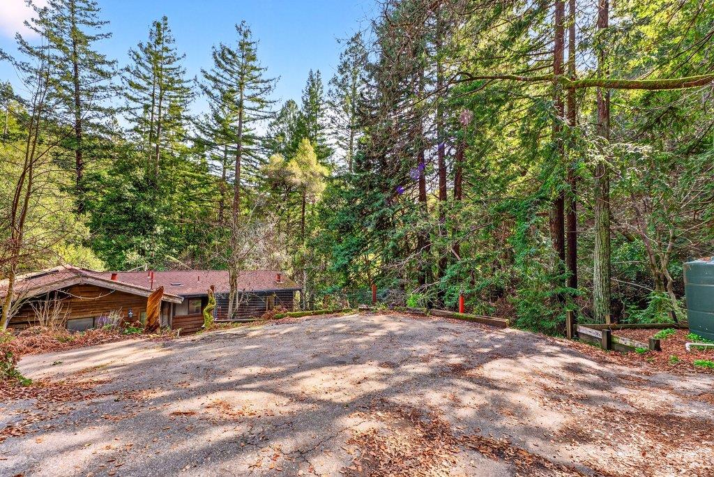 13033 Lompico Road Felton, CA 95018 - Photo 32 of 32 a backyard of a house with table and chairs