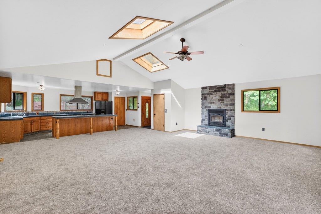 13033 Lompico Road Felton, CA 95018 - Photo 7 of 32 a view of a livingroom with furniture and a kitchen