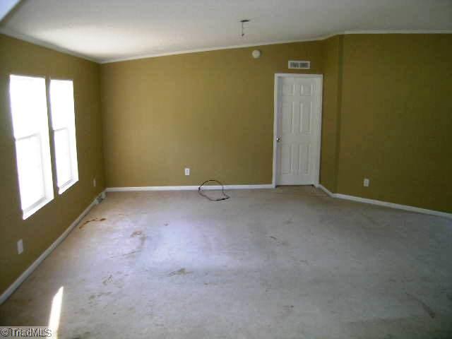 9060 Moore Road Tobaccoville, NC 27050 - Photo 3 of 16 Living Room.