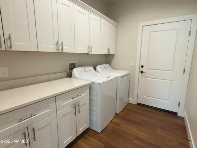 a utility room with sink dryer and washer