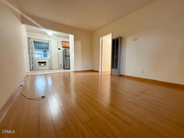 315 East California Avenue, Unit A Glendale, CA 91206 - Photo 3 of 11 a view of an empty room with wooden floor and a window