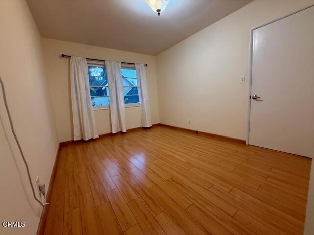 315 East California Avenue, Unit A Glendale, CA 91206 - Photo 9 of 11 an empty room with wooden floor and windows