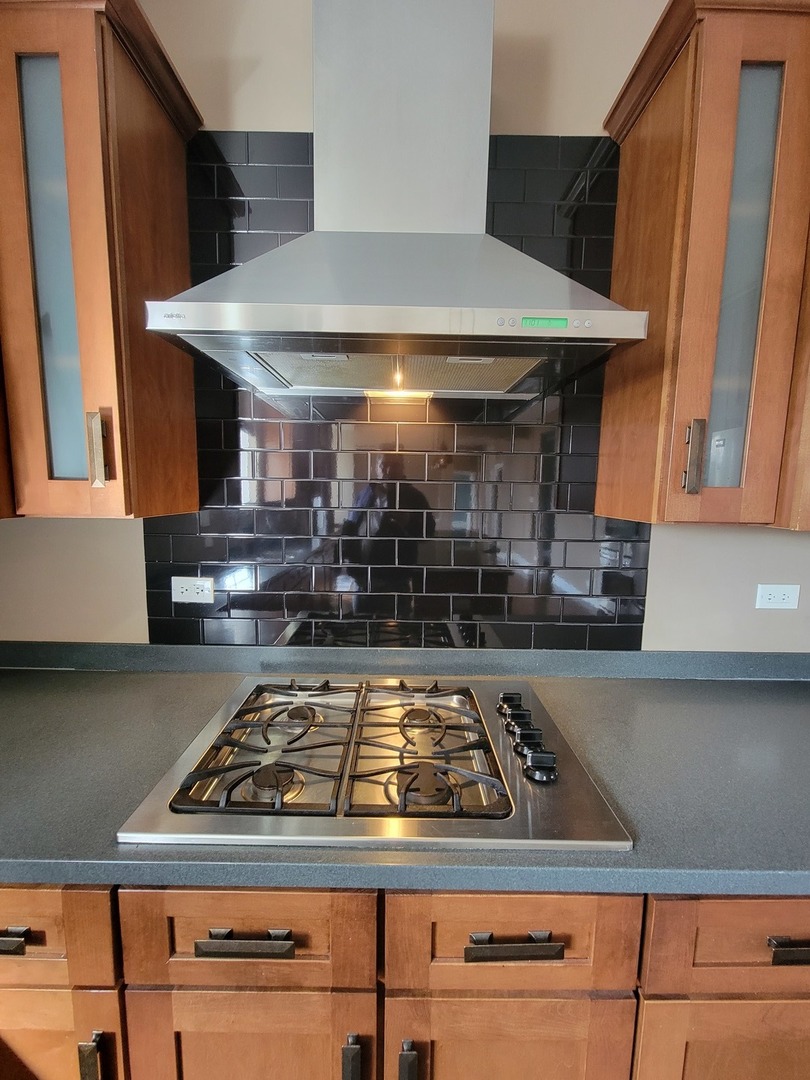 904 Deer Path Drive Antioch, IL 60002 - Photo 15 of 42 a stove top oven sitting inside of a kitchen