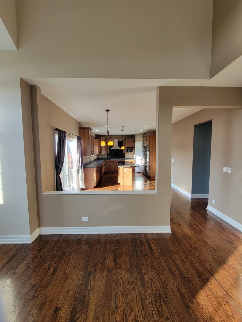 904 Deer Path Drive Antioch, IL 60002 - Photo 16 of 42 a view of a living room with wooden floor