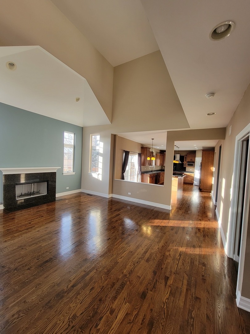 904 Deer Path Drive Antioch, IL 60002 - Photo 17 of 42 a view of livingroom with hardwood floor and a fireplace