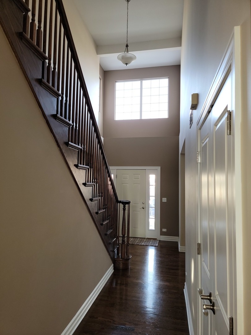 904 Deer Path Drive Antioch, IL 60002 - Photo 4 of 42 a view of entryway and hall with wooden floor