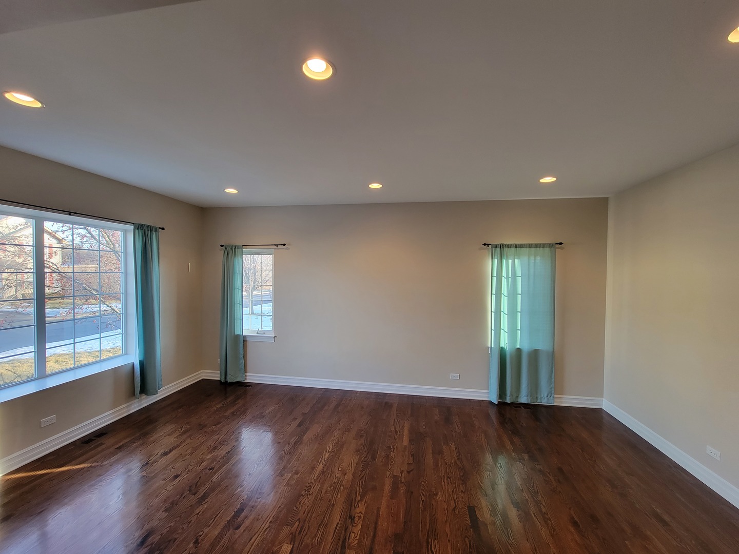 904 Deer Path Drive Antioch, IL 60002 - Photo 5 of 42 an empty room with wooden floor and windows