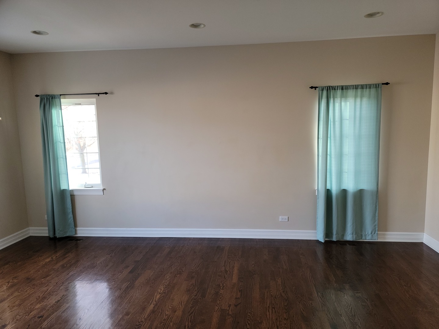 904 Deer Path Drive Antioch, IL 60002 - Photo 6 of 42 an empty room with wooden floor and windows