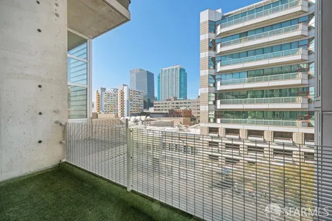 a view of a balcony with a ceiling fan