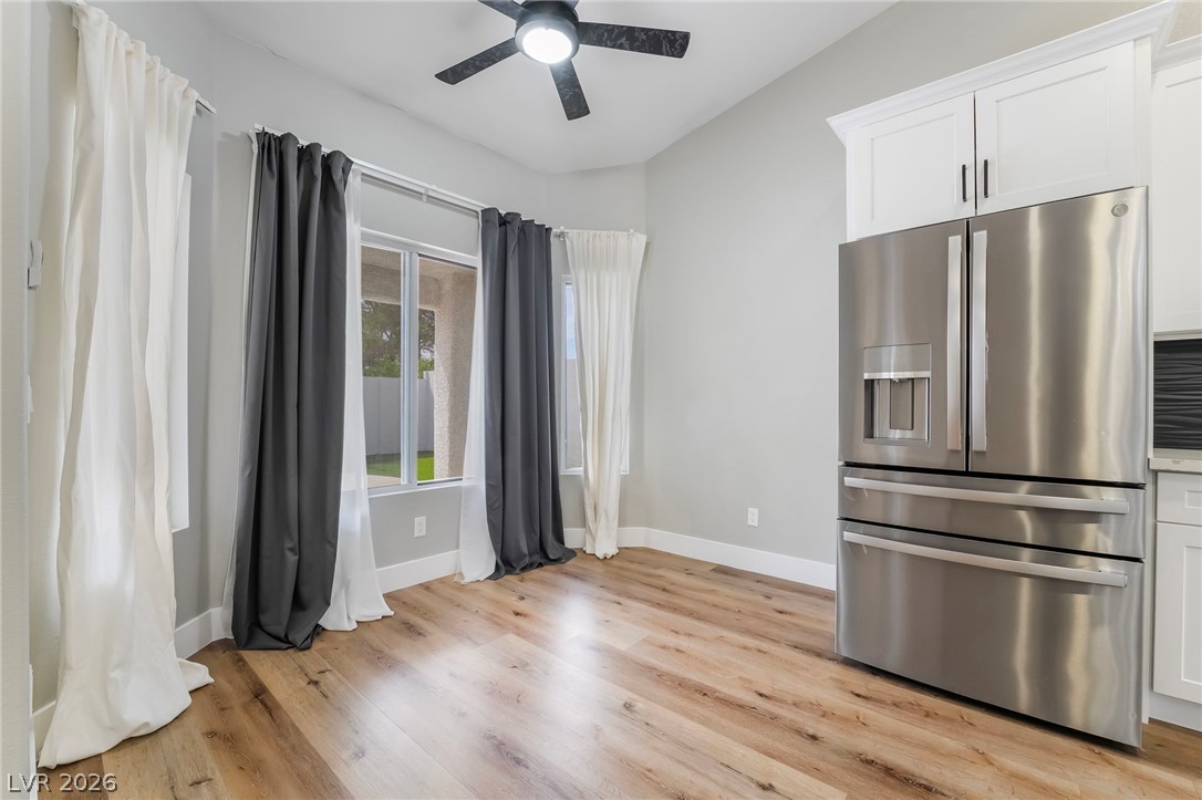 9171 West Viking Road Las Vegas, NV 89147 - Photo 14 of 43 A pristine kitchen area, equipped with modern stainless steel appliances and durable wood-look flooring.