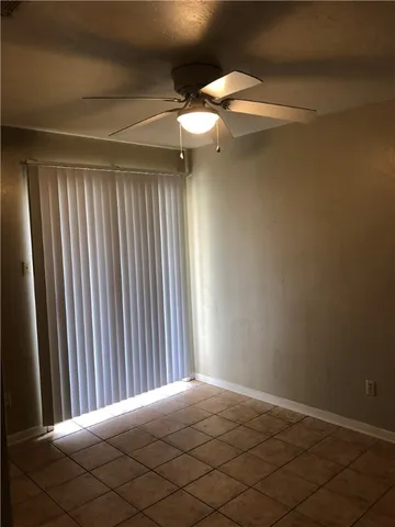 a bathroom with a granite countertop toilet and sink
