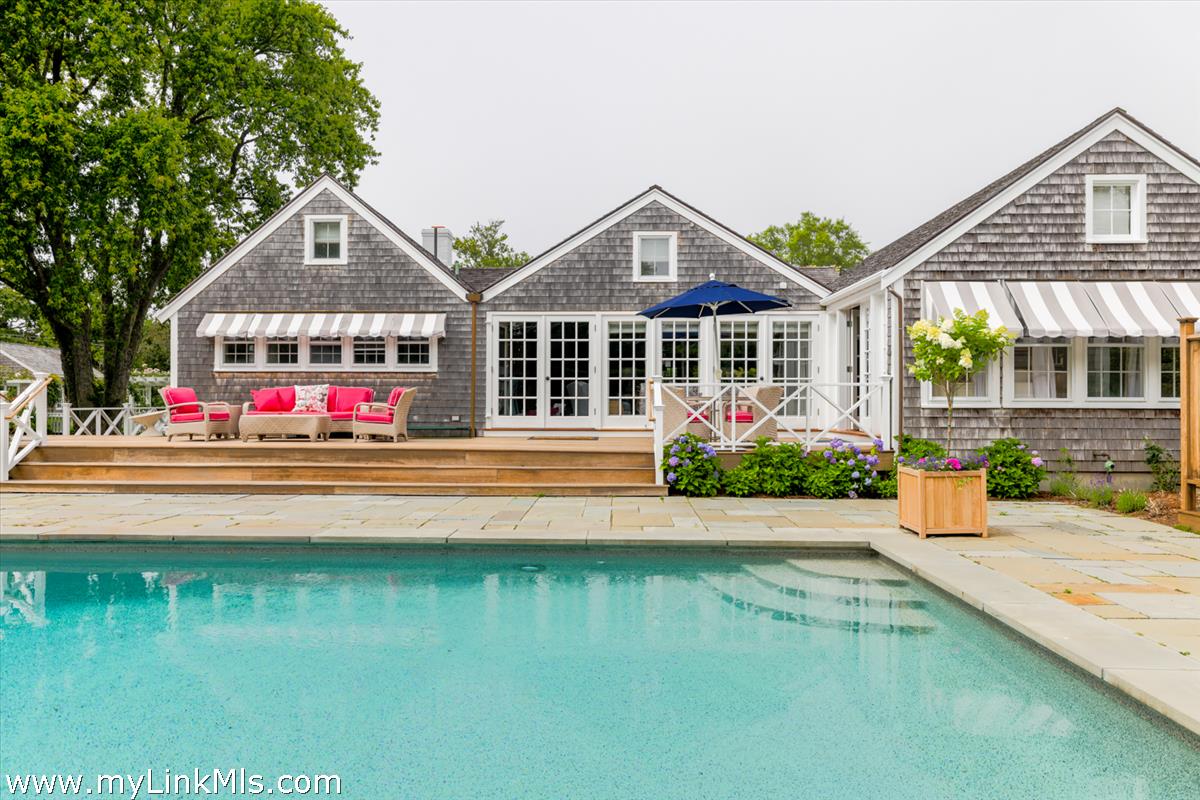 14 & 16 Coffin Street Nantucket, MA 02554 - Photo 24 of 50 a front view of a house with swimming pool having outdoor seating