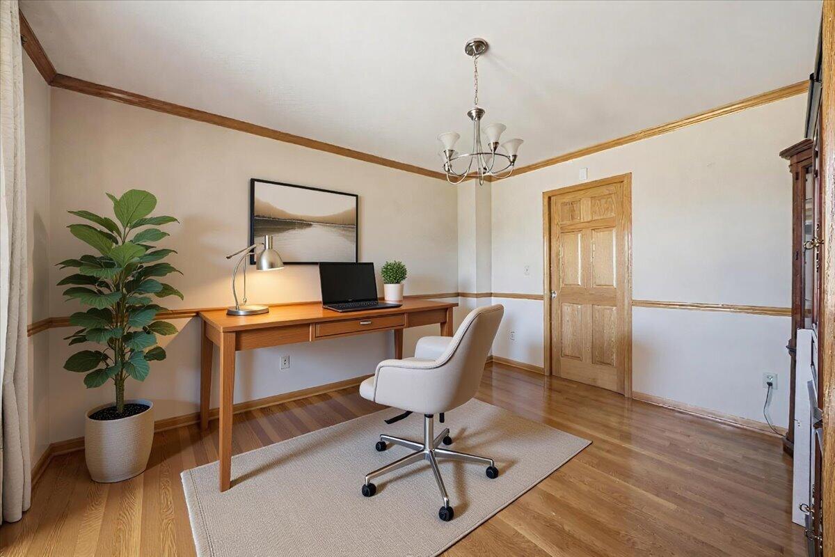 9741 Whitehall Garden Munster, IN 46321 - Photo 11 of 30 a view of a workspace with furniture and a potted plant