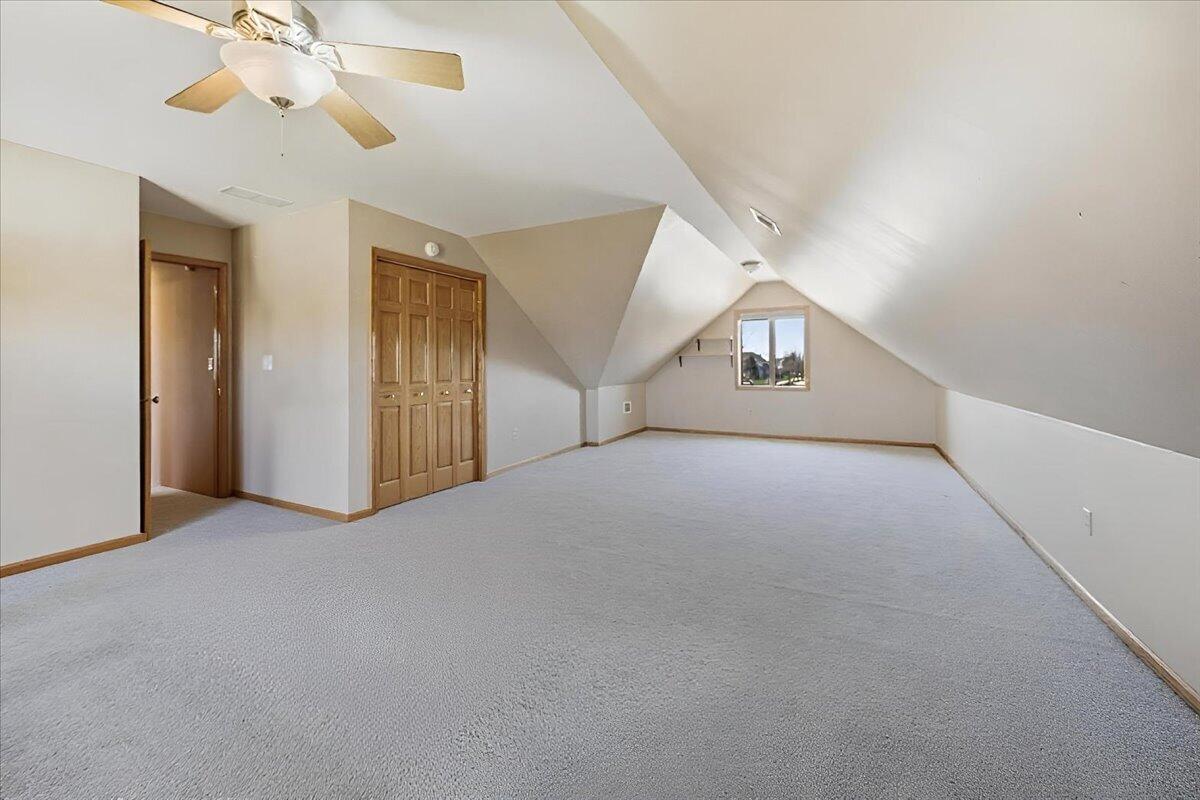 9741 Whitehall Garden Munster, IN 46321 - Photo 22 of 30 a view of a livingroom with a ceiling fan and window