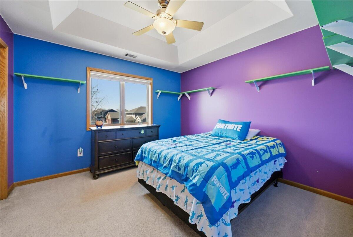 9741 Whitehall Garden Munster, IN 46321 - Photo 23 of 30 a bedroom with a bed and a ceiling fan