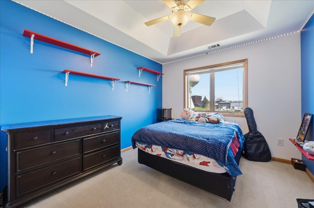 9741 Whitehall Garden Munster, IN 46321 - Photo 25 of 30 a bedroom with a bed and a chandelier