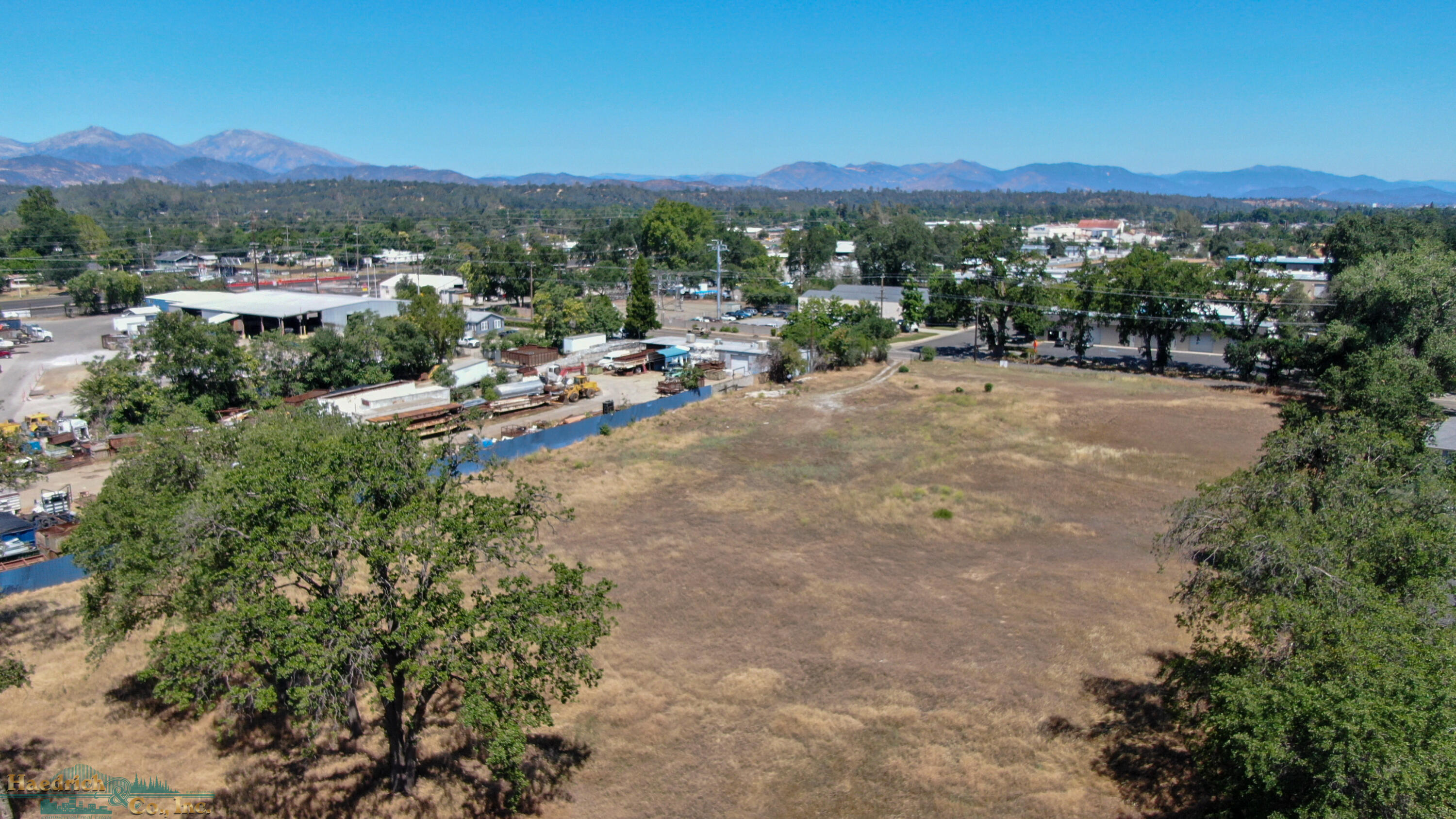 2431 Girvan Road Redding, CA 96001 - Photo 7 of 14 a view of a city with lush green forest