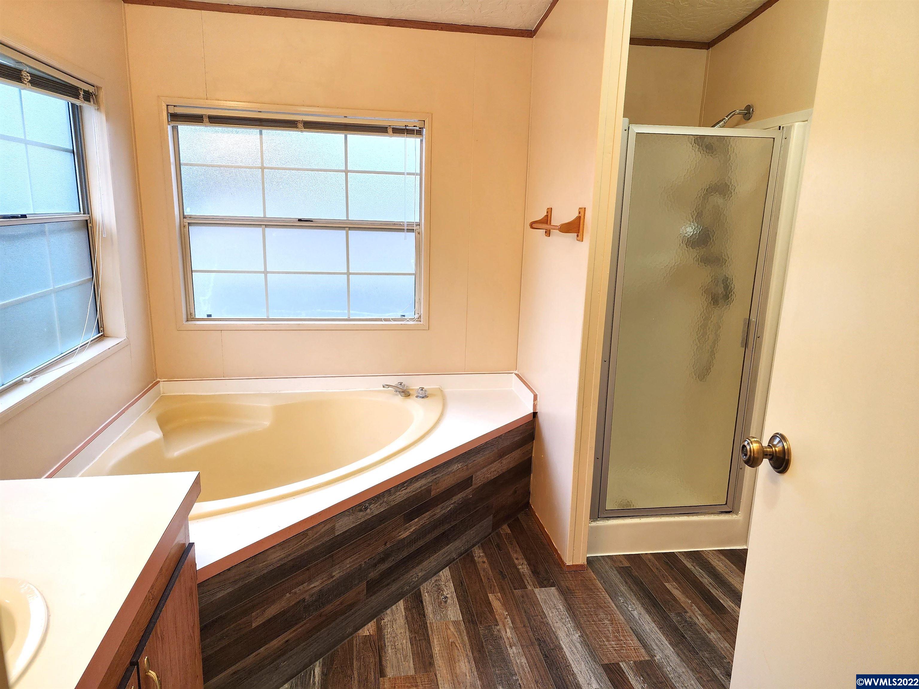 205 Boone Road Southeast, Unit 58 Salem, OR 97306 - Photo 14 of 19 a bathroom with a bathtub and a shower