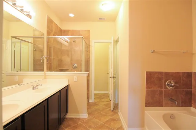 a bathroom with a bathtub and a sink