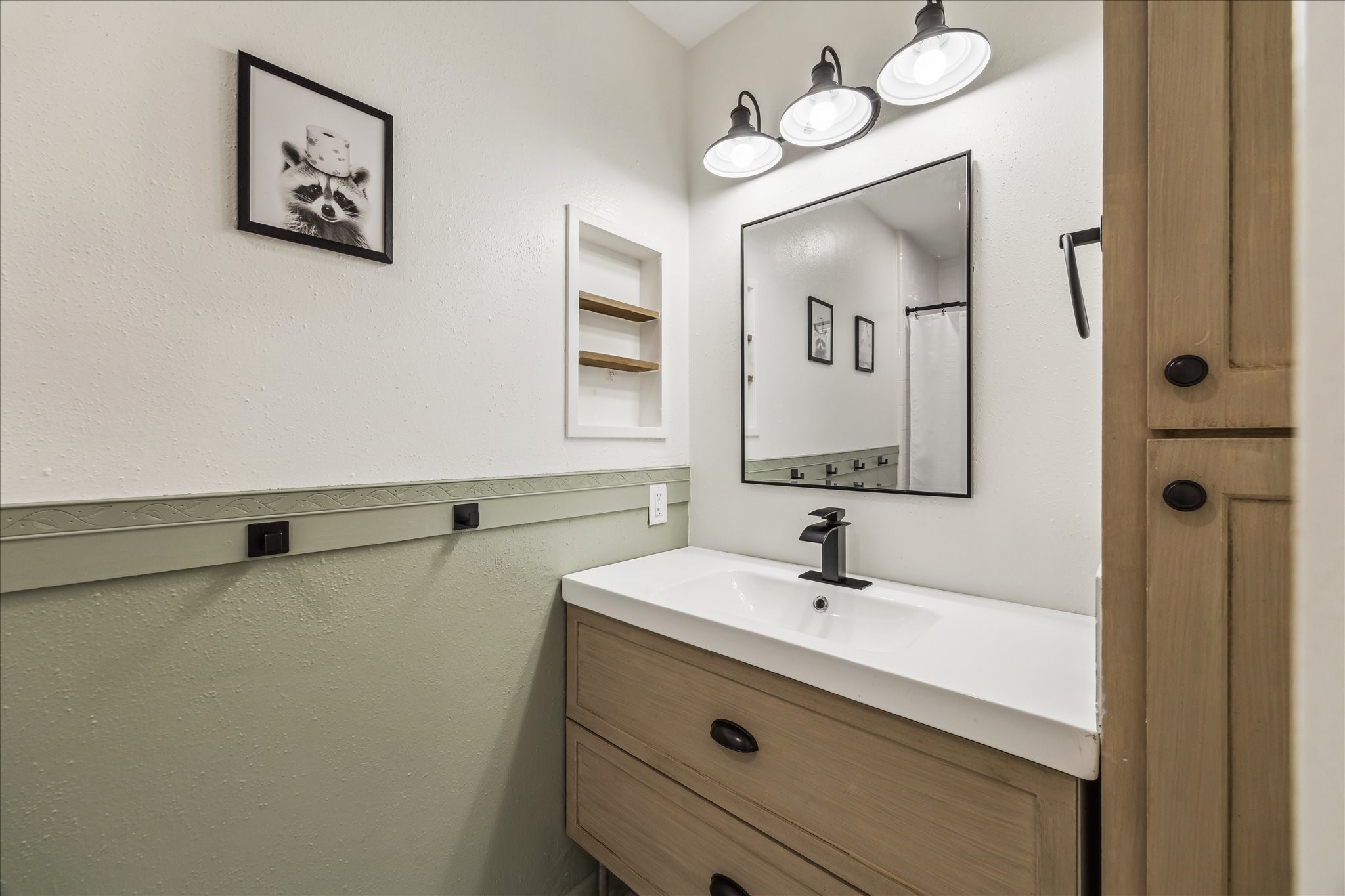 5823 Valley Forge Drive, Unit 93 Houston, TX 77057 - Photo 12 of 22 Hall bath with vanity and linen cabinet storage