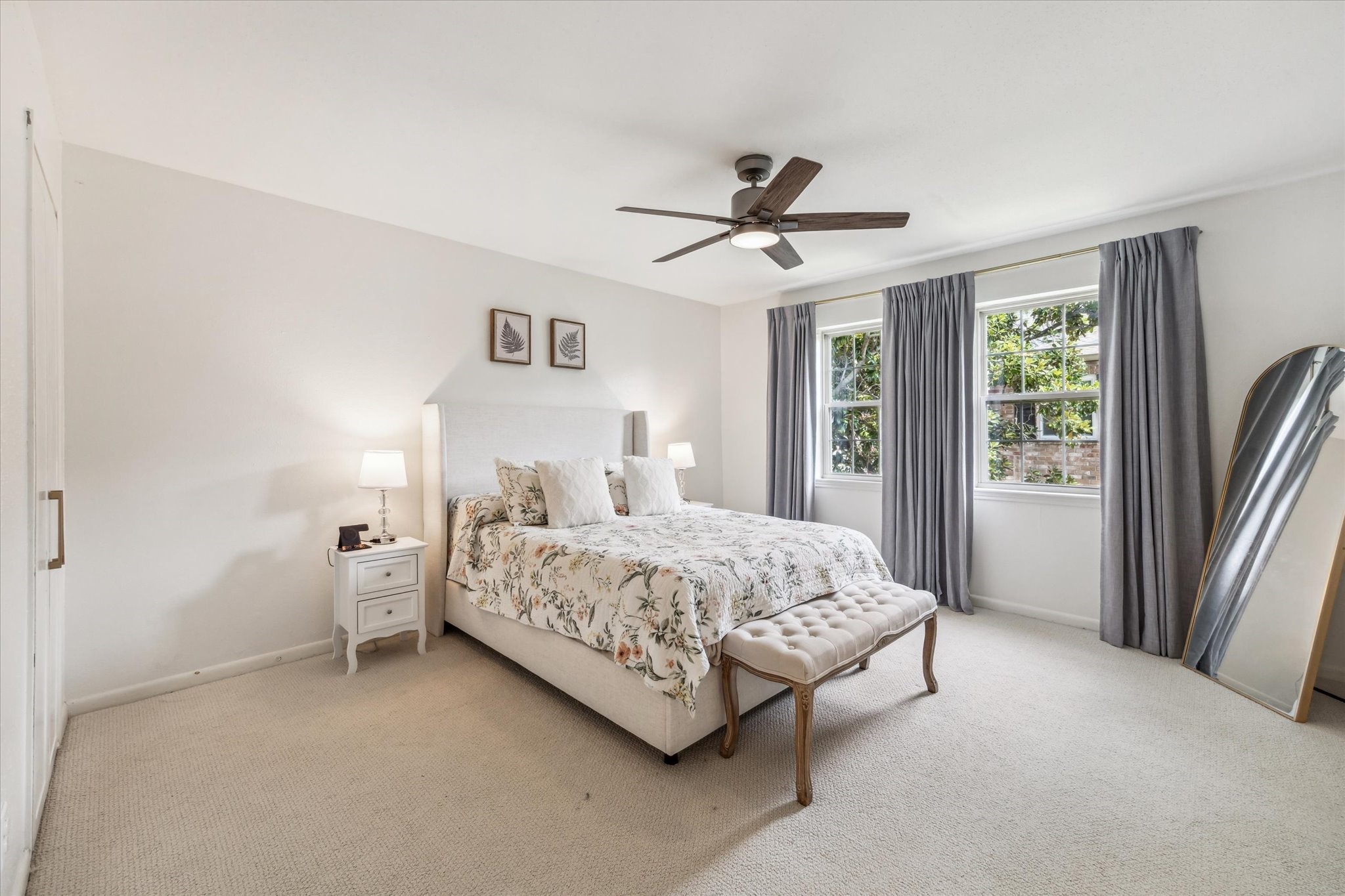 5823 Valley Forge Drive, Unit 93 Houston, TX 77057 - Photo 14 of 22 Primary bedroom with blackout curtains and views to front courtyard
