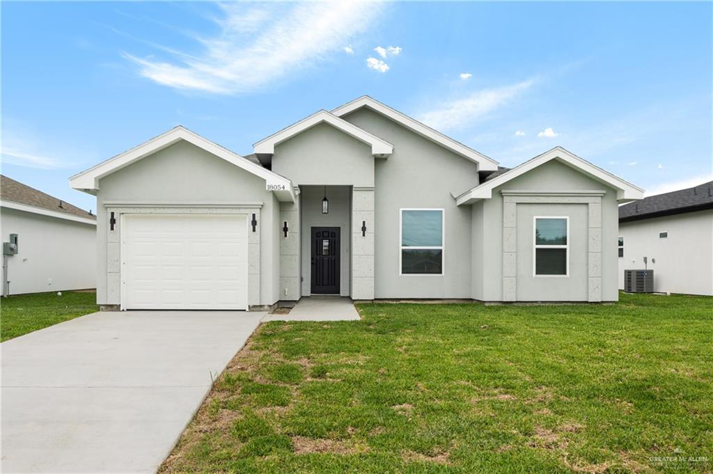 Contemporary stucco exterior with a gray finish