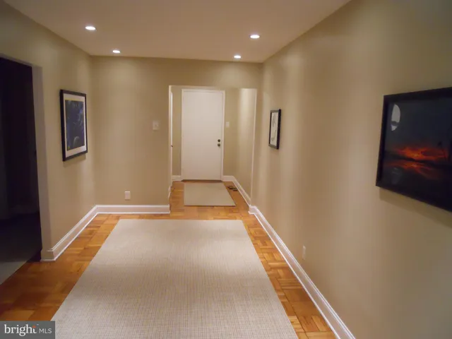 a view of hallway with an empty room