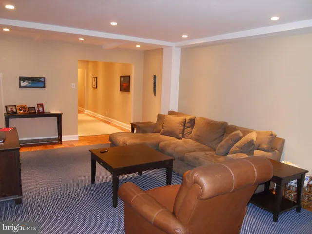 a living room with furniture and a table